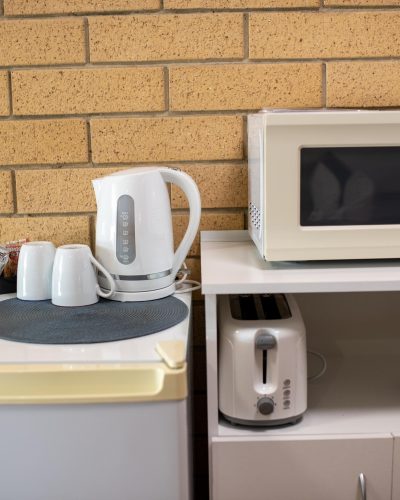 Home appliances in King Premium Room at Mundubbera Motel