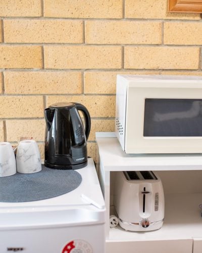 Home appliances in King Premium Room at Mundubbera Motel