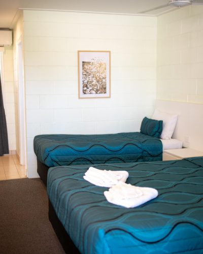 Comfortable queen single room with one single bed and one queen bed