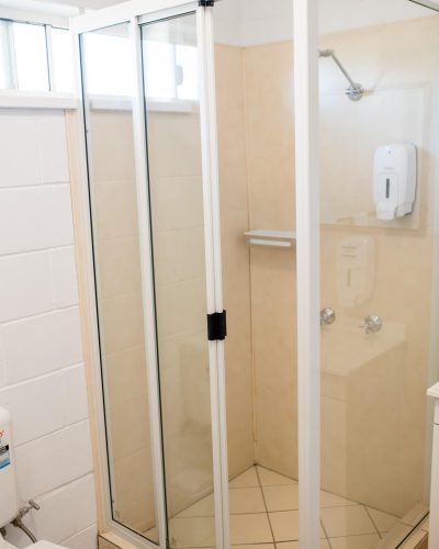 Clean bathroom with shower enclosure in Mundubbera Motel